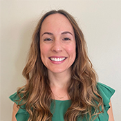 Chrissie Fernandez, attorney at Landis Arn & Jaynes. A woman with long brown hair and an emerald green blouse smiles at the camera.